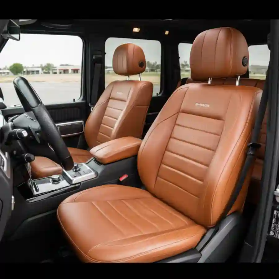 Luxury interior of a Mercedes G-Wagon G550 featuring premium leather seats and a stylish dashboard, highlighting customization options for Big Limos' limousine configurator.