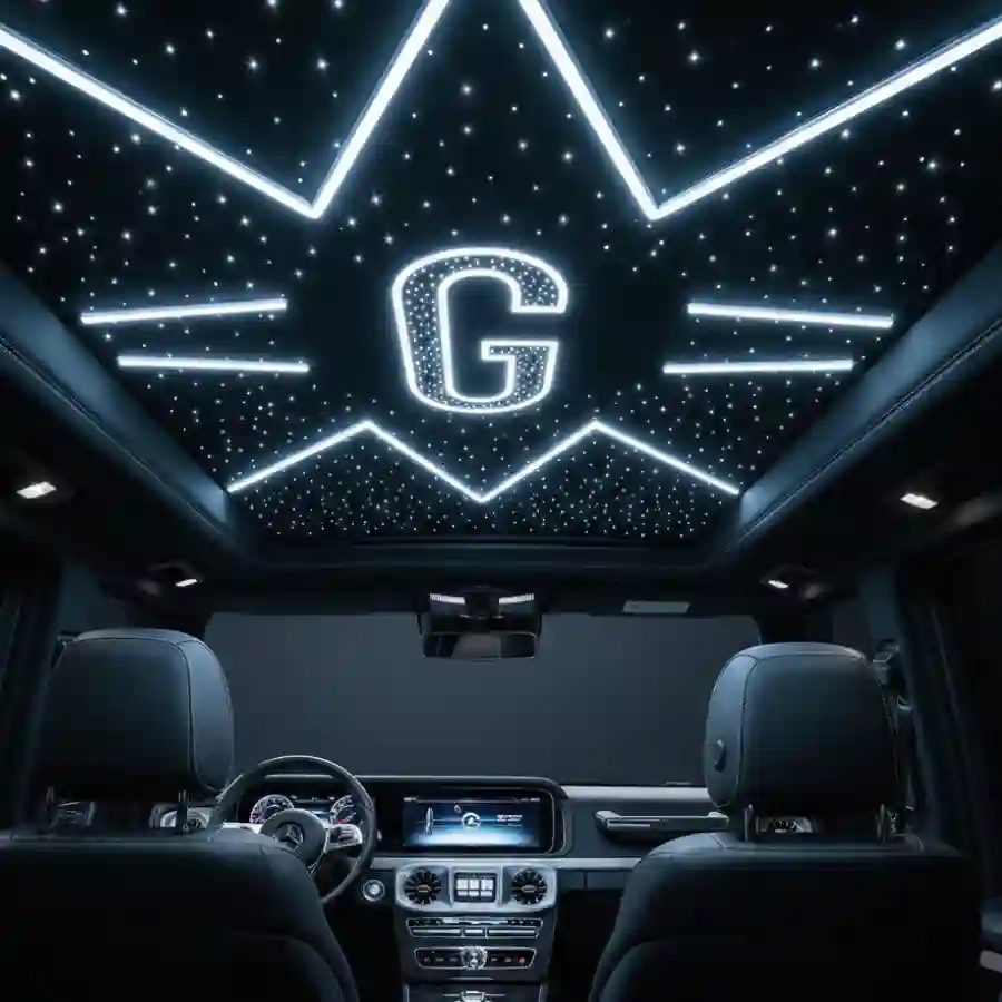 Interior view of a Mercedes G-Wagon G63 limousine featuring a premium LED ceiling with starry lights and a prominent illuminated 'G' design, highlighting luxury customization options.