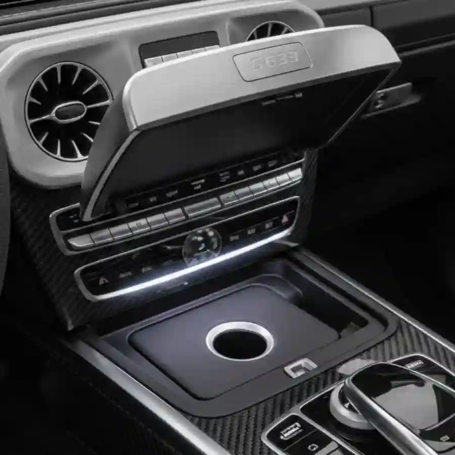 Mercedes G-Wagon G63 interior featuring premium dashboard controls, integrated trash compartment, and luxurious finishes for customized limousine experience.